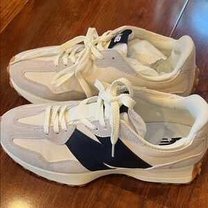 New Balance unisex White and Navy Sneakers
Size 8 men’s 
Size 9.5 women’s